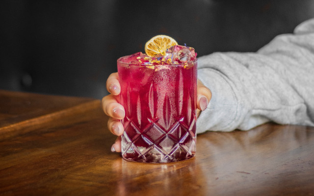 Person holding drink wooden table free wallpaper for desktop - medium preview image