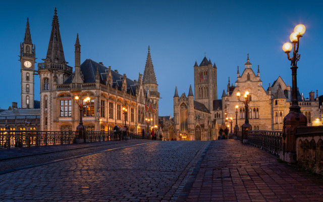 Cobblestone street clocktower night lights free wallpaper for desktop - medium preview image