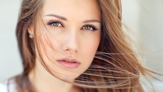 Blowing hair portrait brown eyes free wallpaper for desktop - medium preview image