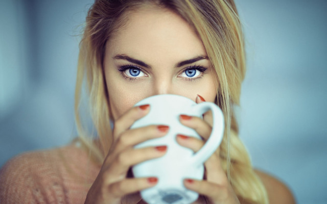 Woman holding white coffee cup free wallpaper for desktop - medium preview image