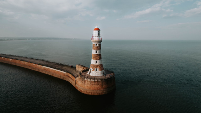 Lighthouse ocean cloudy sky tilt free wallpaper for desktop - medium preview image