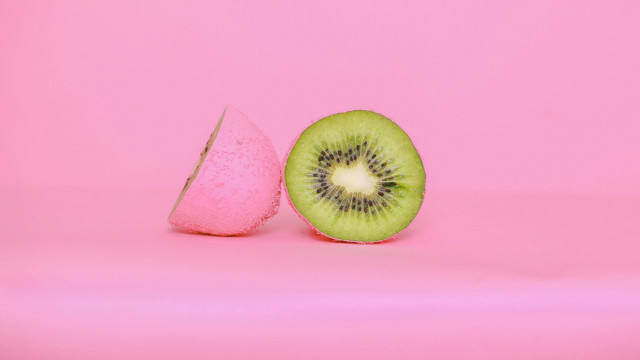 Kiwi slice pink background pink free wallpaper for desktop - medium preview image