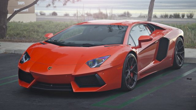 Red sports car parking lot #66 free wallpaper for desktop - medium preview image