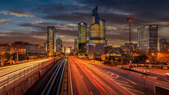 City skyline train crossing night free wallpaper for desktop - medium preview image