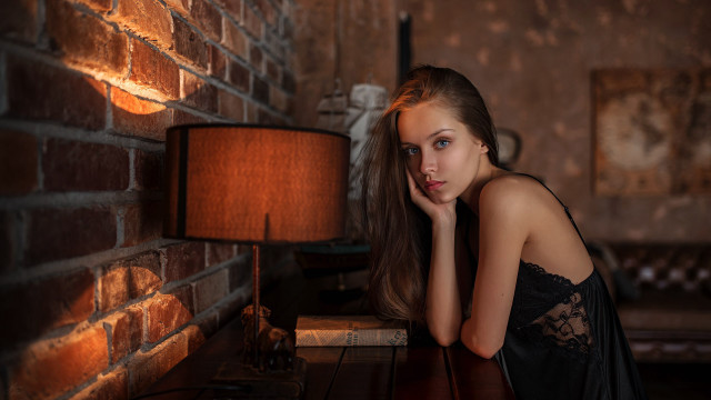 Woman leaning table lamp brick free wallpaper for desktop - medium preview image