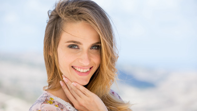 Smiling woman mountain background blonde free wallpaper for desktop - medium preview image