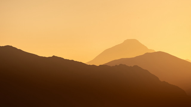 Mountain range bird sunset hazy free wallpaper for desktop - medium preview image