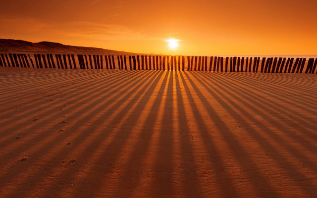 Beach fence sunset person sand free wallpaper for desktop - medium preview image