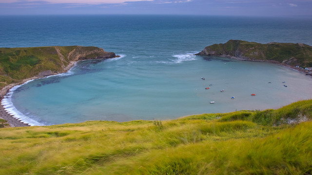 Beach water hill boat grassy free wallpaper for desktop - medium preview image