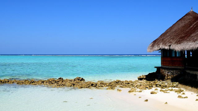 Beach hut blue ocean rock free wallpaper for desktop - medium preview image