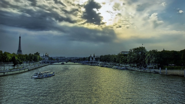 Paris river boat cloudy sky free wallpaper for desktop - medium preview image
