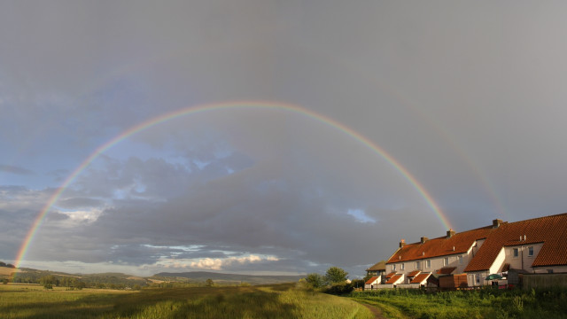 Rainbow rural houses dirtroad grassyfield free wallpaper for desktop - medium preview image