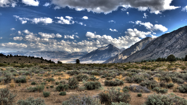 Mountain range clouds bushes cityscape free wallpaper for desktop - medium preview image