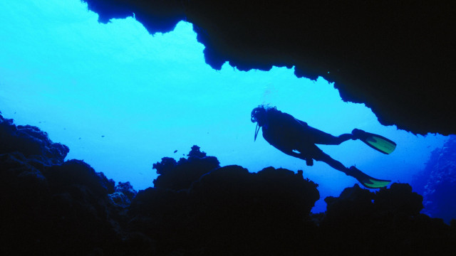 Scuba diver cave silhouette blue free wallpaper for desktop - medium preview image