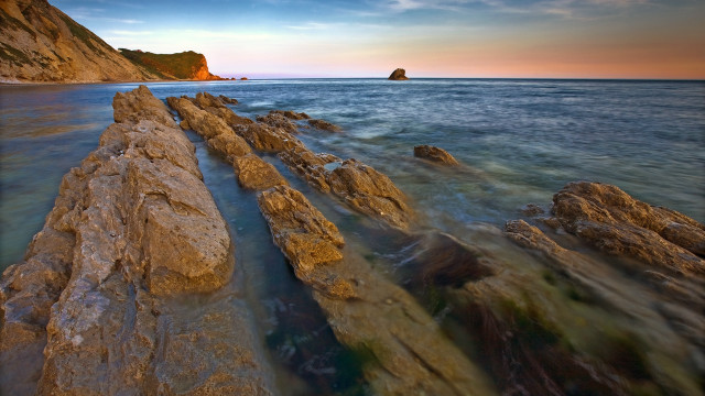 Rocky beach rocks polarized sunset free wallpaper for desktop - medium preview image