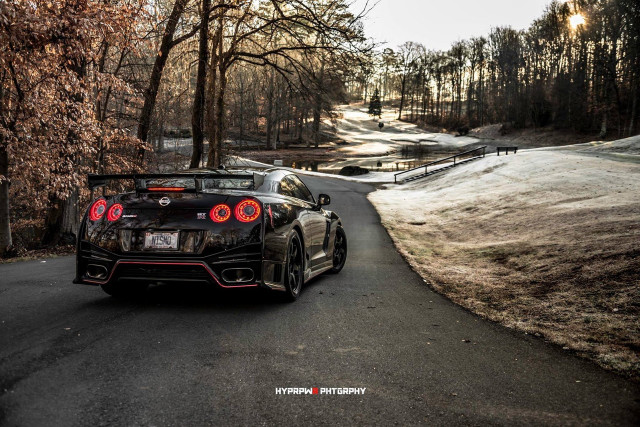 Black sports car woods road free wallpaper for desktop - medium preview image