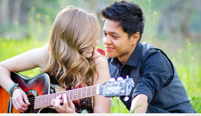 Man woman grass playing guitar #3 free wallpaper for desktop - medium preview image