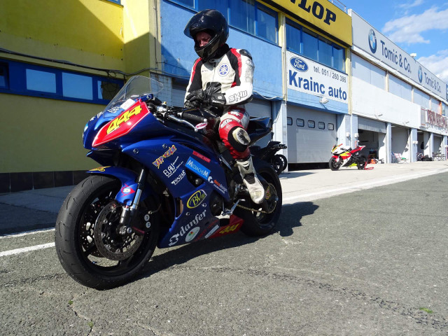 Man motorcycle street building yellow free wallpaper for desktop - medium preview image