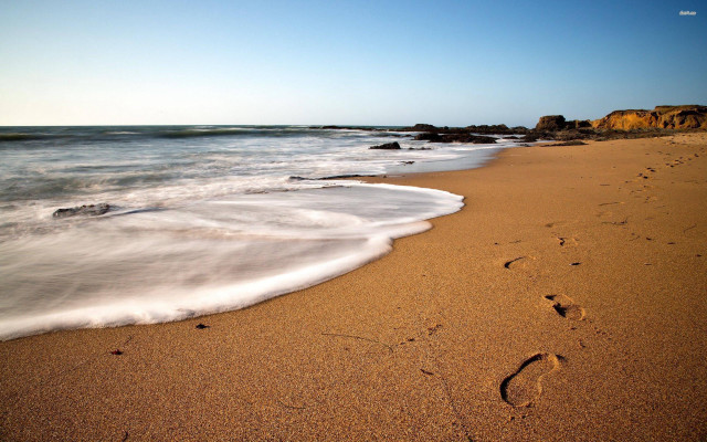 Beach waves person walking rock free wallpaper for desktop - medium preview image