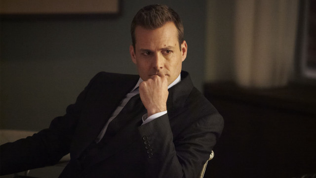 Man suit sitting hand chin free wallpaper for desktop - medium preview image