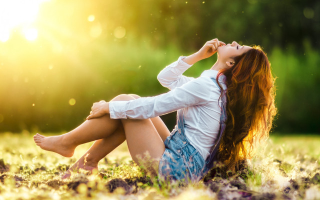 Woman sitting in grass sunlight free wallpaper for desktop - medium preview image