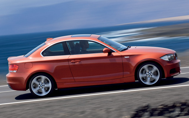 Red car ocean road beach free wallpaper for desktop - medium preview image