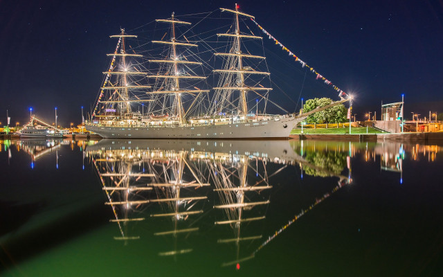 Large boat docked night sails free wallpaper for desktop - medium preview image