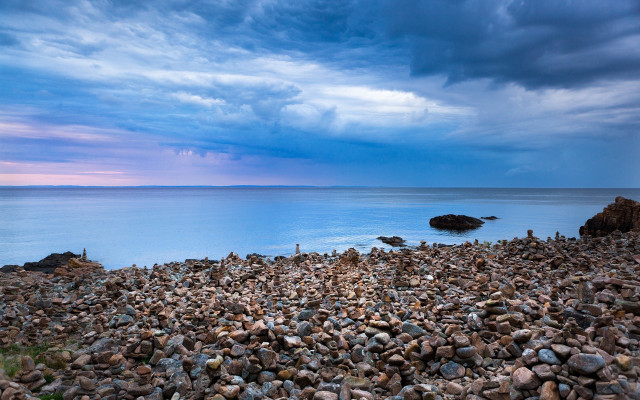 Rocky beach stormy water sky free wallpaper for desktop - medium preview image