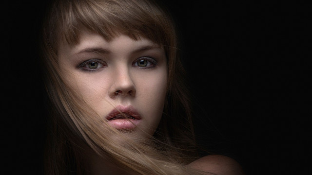 Woman longhair blackbackground serious look free wallpaper for desktop - medium preview image