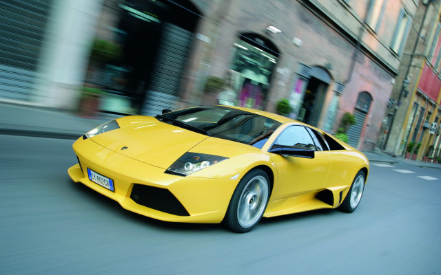 Yellow sports car city clock free wallpaper for desktop - medium preview image