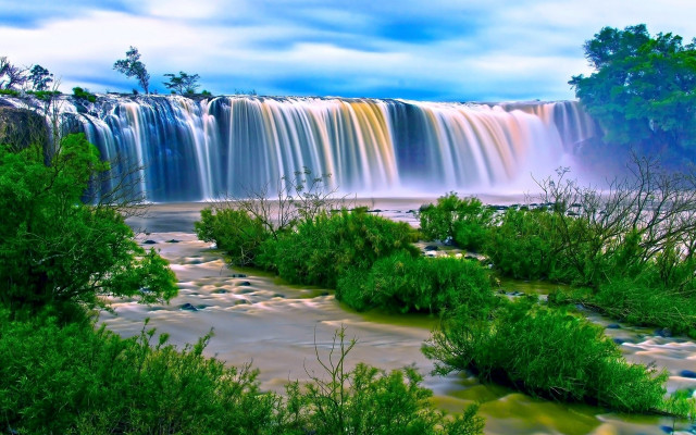 Waterfall side trees blue sky free wallpaper for desktop - medium preview image