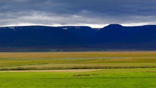 Horse grazing mountains water sunset free wallpaper for desktop - medium preview image