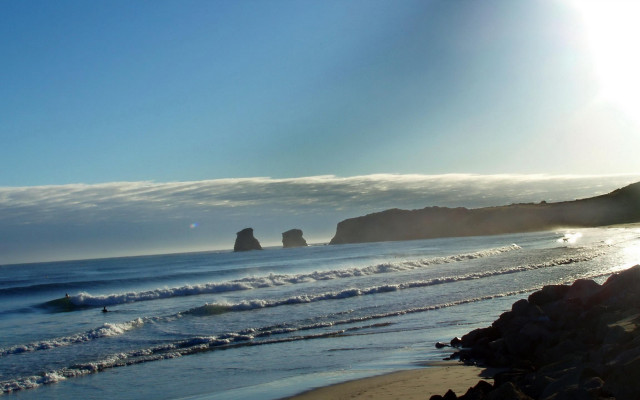 Beach rock formation surfboard ocean free wallpaper for desktop - medium preview image