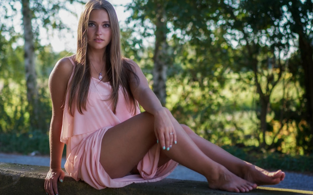 Woman pink dress sitting woods free wallpaper for desktop - medium preview image