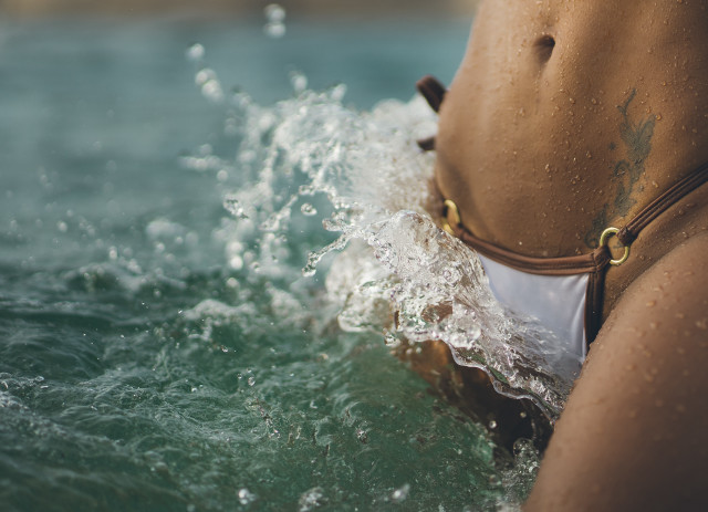 Woman bikini water hands in free wallpaper for desktop - medium preview image