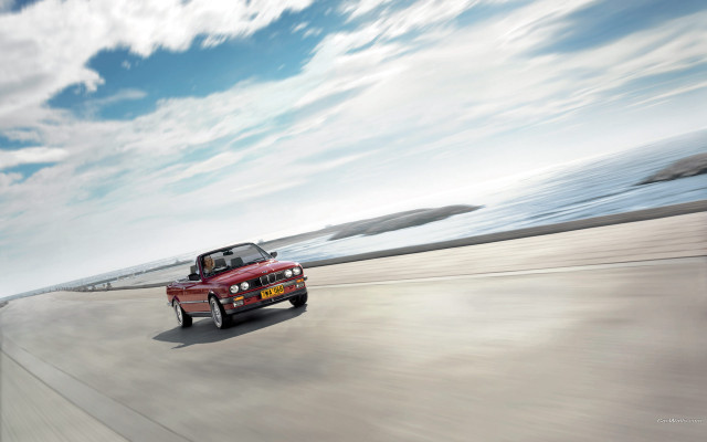 Red car ocean sky beach free wallpaper for desktop - medium preview image