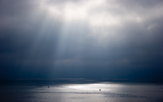 Boat ocean cloudy sky sunbeams free wallpaper for desktop - medium preview image