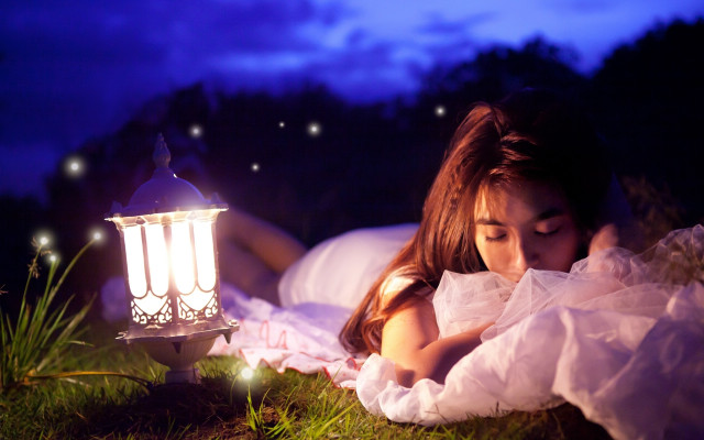 Woman laying lantern night dreamlike free wallpaper for desktop - medium preview image