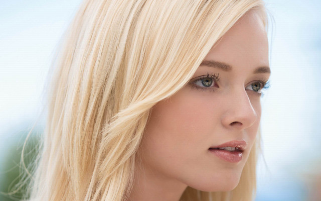 Blonde blue eyed serious woman free wallpaper for desktop - medium preview image