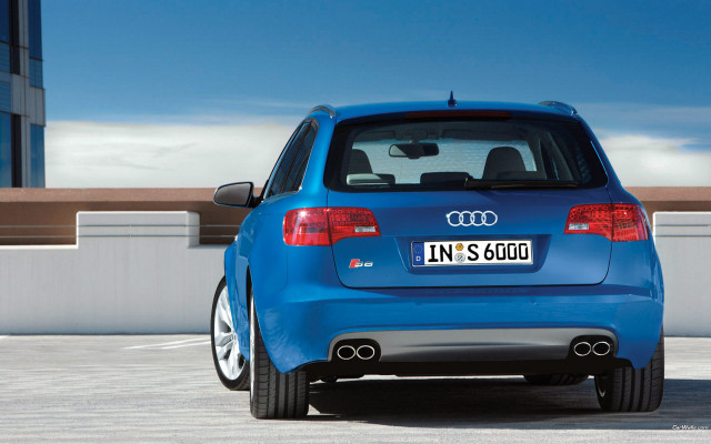 Blue car parked parking lot free wallpaper for desktop - medium preview image