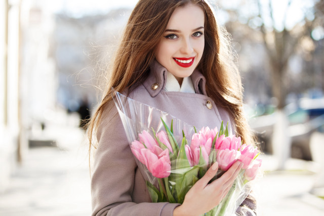 Woman smiling pink flower bouquet free wallpaper for desktop - medium preview image