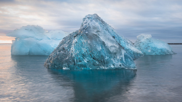 Large iceberg ocean clouds ecological free wallpaper for desktop - medium preview image