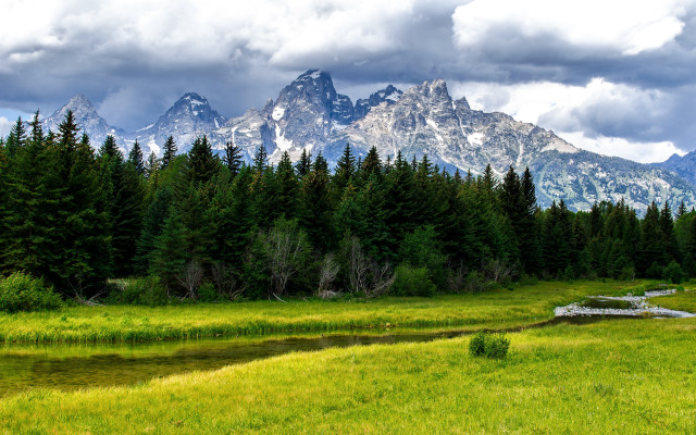 Grassy field stream mountains clouds #2 free wallpaper for desktop - medium preview image