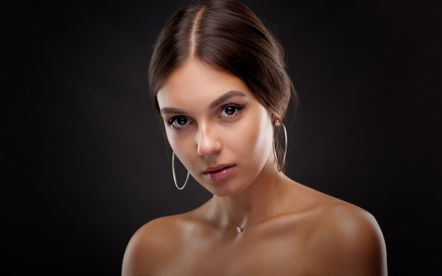 Woman hoop earrings black background free wallpaper for desktop - medium preview image