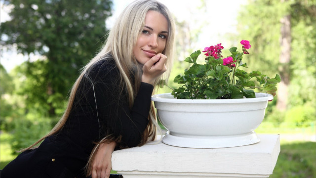 Woman pottedplant pinkflower portrait ecological free wallpaper for desktop - medium preview image