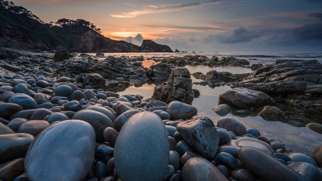 Beach rocks water sunset mountain free wallpaper for desktop - medium preview image