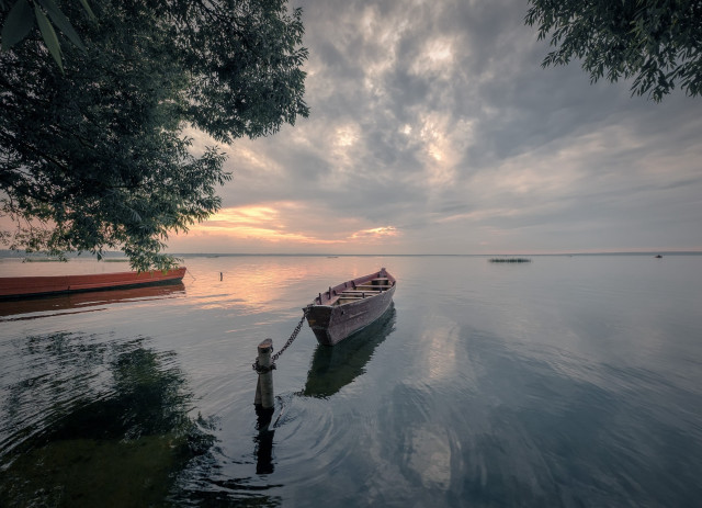 Man water boat cloudy sky free wallpaper for desktop - medium preview image