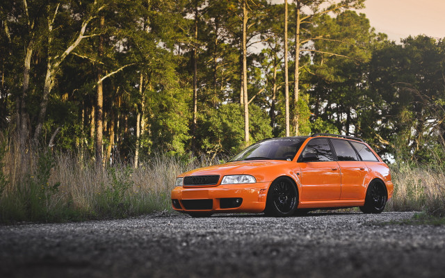 Orange car forest gravel road free wallpaper for desktop - medium preview image