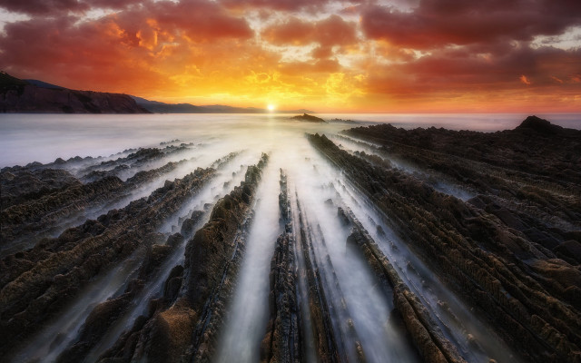 Sunset rocky beach water rocks free wallpaper for desktop - medium preview image