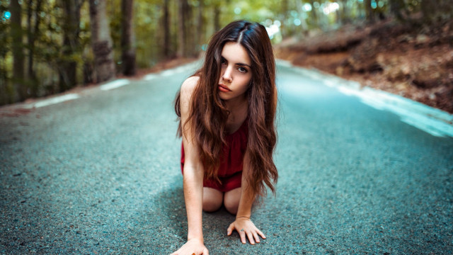 Woman red bodysuit crouching woods free wallpaper for desktop - medium preview image